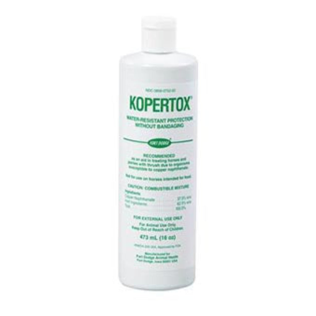 A bottle of KOPERTOX horse care product against thrush, with label detailing usage and protection information.